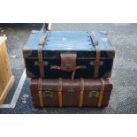 A 'Finnigans of Manchester' canvas and leather bound travelling trunk; together with another