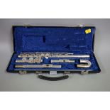 A Blessing electroplated concert flute, No. B101c, in fitted case.