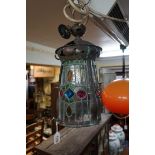 An Arts & Crafts copper and leaded glass hall lantern, 38cm high.