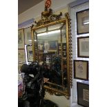 (THH) An antique carved giltwood framed wall mirror, in the neo-classical style, 155 x 86.5cm,