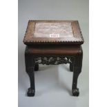 A small Chinese carved hardwood and marble top jardiniere stand, on ball and claw feet, 22cm high