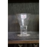 A 1911 George V commemorative coronation glass, inset with silver 3d coin, 11.5cm high.