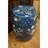 A Chinese blue ground garden seat, late 19th century, decorated with flowering branches and
