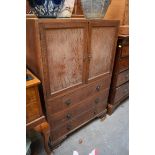 A 1920s/30s limed oak side cabinet, in the Heal's style, 76cm wide.