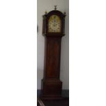 (THH) A George III mahogany eight day longcase clock, the 12in arched brass and silvered dial