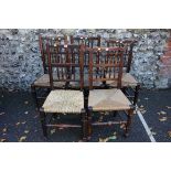 A harlequin set of five stained beech rush seated chairs. This lot can only be collected on Saturday