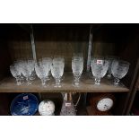 A part suite of Waterford drinking glasses, comprising: two champagne flutes; six white wine; four