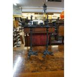 A pair of 19th century neo-classical style patinated bronze three branch tripod candelabra, 38cm