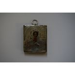 A Russian miniature icon, with painted face and silver oclad, 6.5 x 5.7cm.