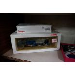 A Marklin OO gauge locomotive, No.3498, boxed; together with a small box of track.