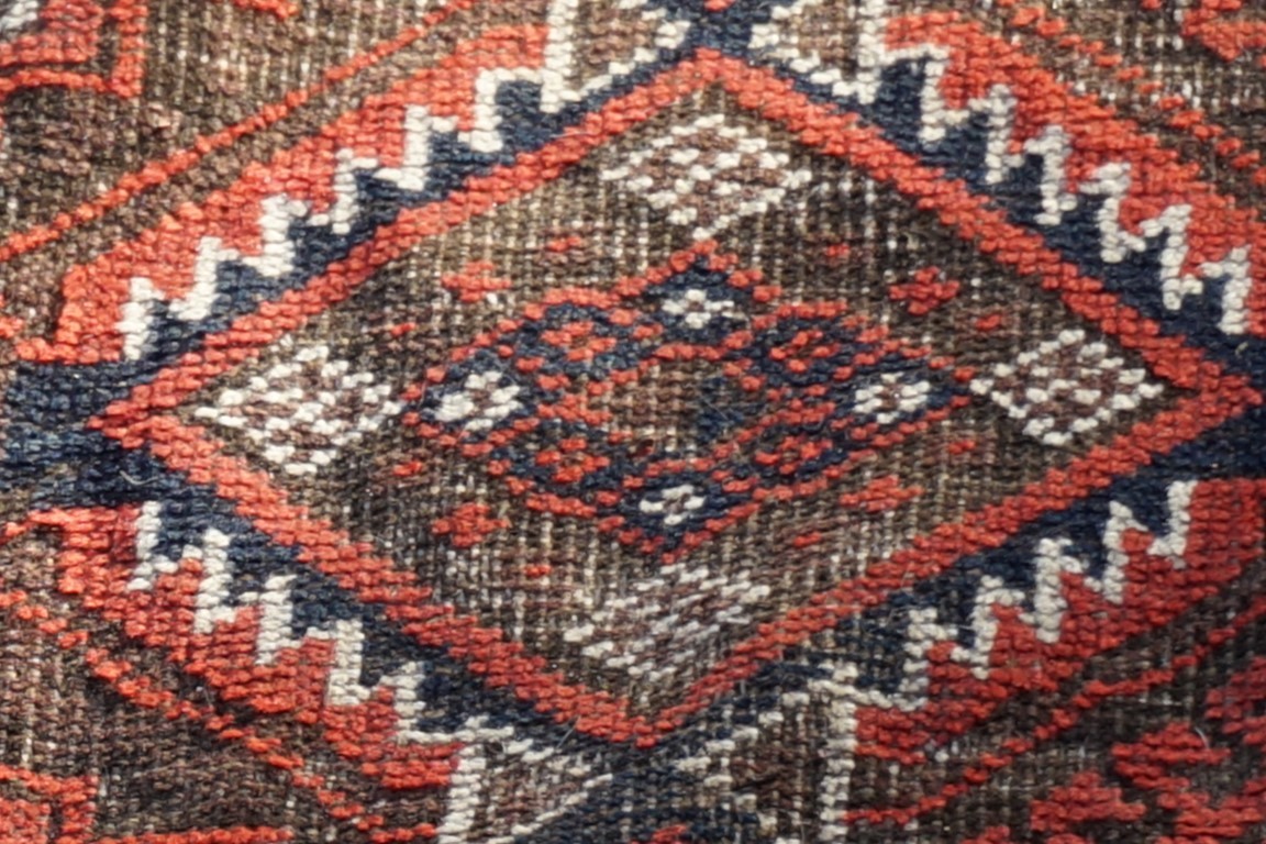 A Bokhara rug, having repeated central field with geometric borders, 182 x 110cm. - Image 2 of 3