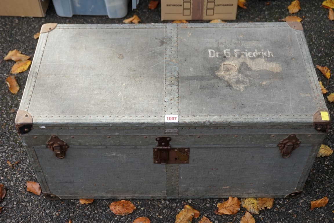 A German metal bound canvas covered travelling trunk, painted 'Dr G Freidrich', by D.R.G.M., 76cm