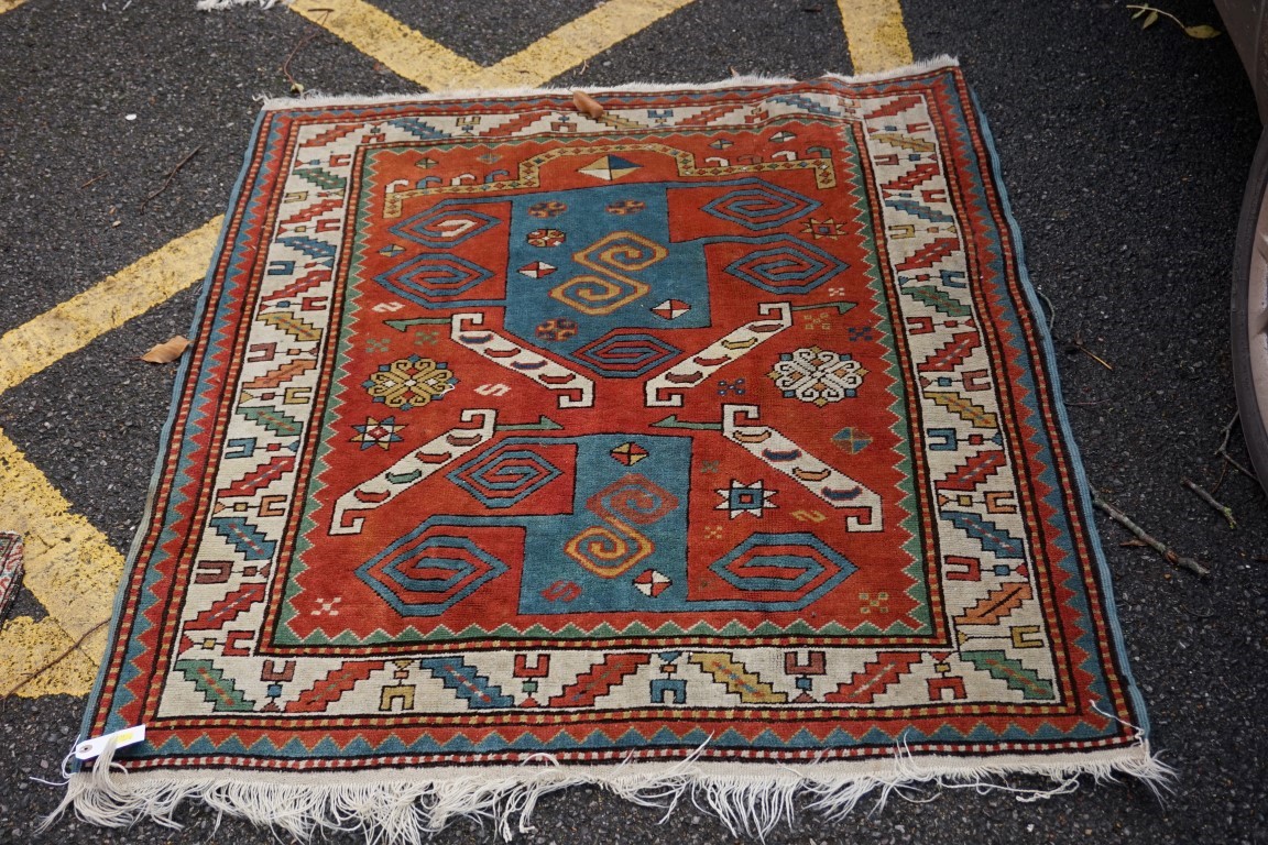 A square Caucasian rug, 128 x 118cm.