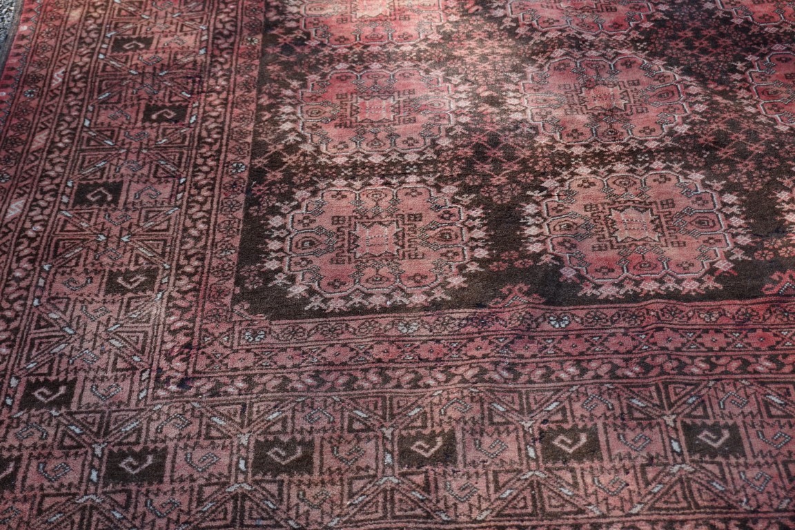 (THH) A Bokhara carpet, having repeated design to central field, with geometric borders, 310 x - Image 2 of 3