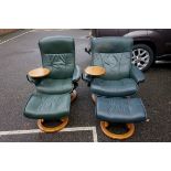 Two Ekornes reclining chairs; together with matching footstools.This lot can only be collected on