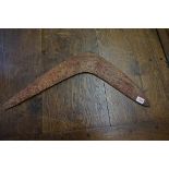 Ethnographica: an Australian boomerang, 64.5cm wide.