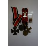 Medals: an interesting group of four German World War II examples, comprising: Iron Cross 2nd class;