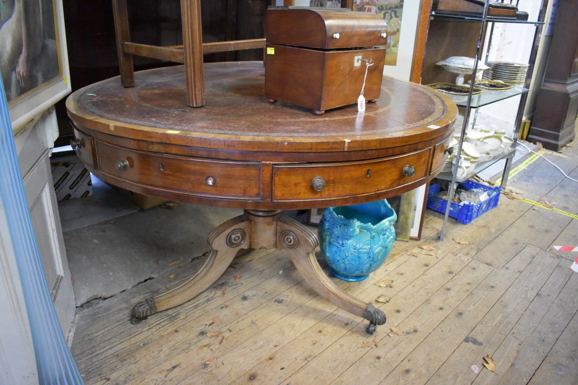 (THH) A 19th century mahogany circular drum top tripod library table, with tooled leather inset