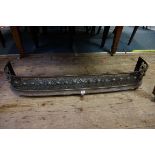 (THH) A 19th century steel fire kerb, with pierced decoration, 118cm wide, (one foot lacking).