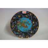A Japanese cloisonne enamel plate, decorated with quails, 24.5cm diameter.