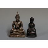 Two white metal skinned buddhas, largest 13cm high. (2)