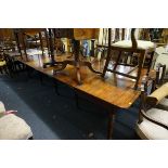(THH) A large and unusual Regency mahogany scissor action extending dining table, possibly Gillow,