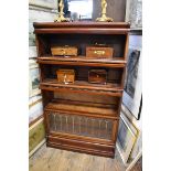 An early 20th century Globe Wernicke style mahogany and leaded glass four tier sectional bookcase,