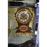 A Louis XV style Boulle mantel clock, the bell striking movement inscribed 'C & S', 25.5cm high,