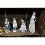 Four Lladro figures, largest 32cm.