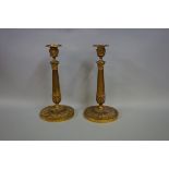 (THH) A pair of 19th century gilt brass candlesticks, in the neo-classical style, 29cm high.