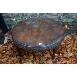 An old circular coffee table.This lot can only be collected on Saturday 19th December (9-2pm).