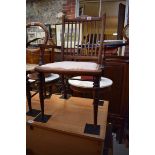 An Edwardian mahogany and line inlaid child's elbow chair, (s.d.).