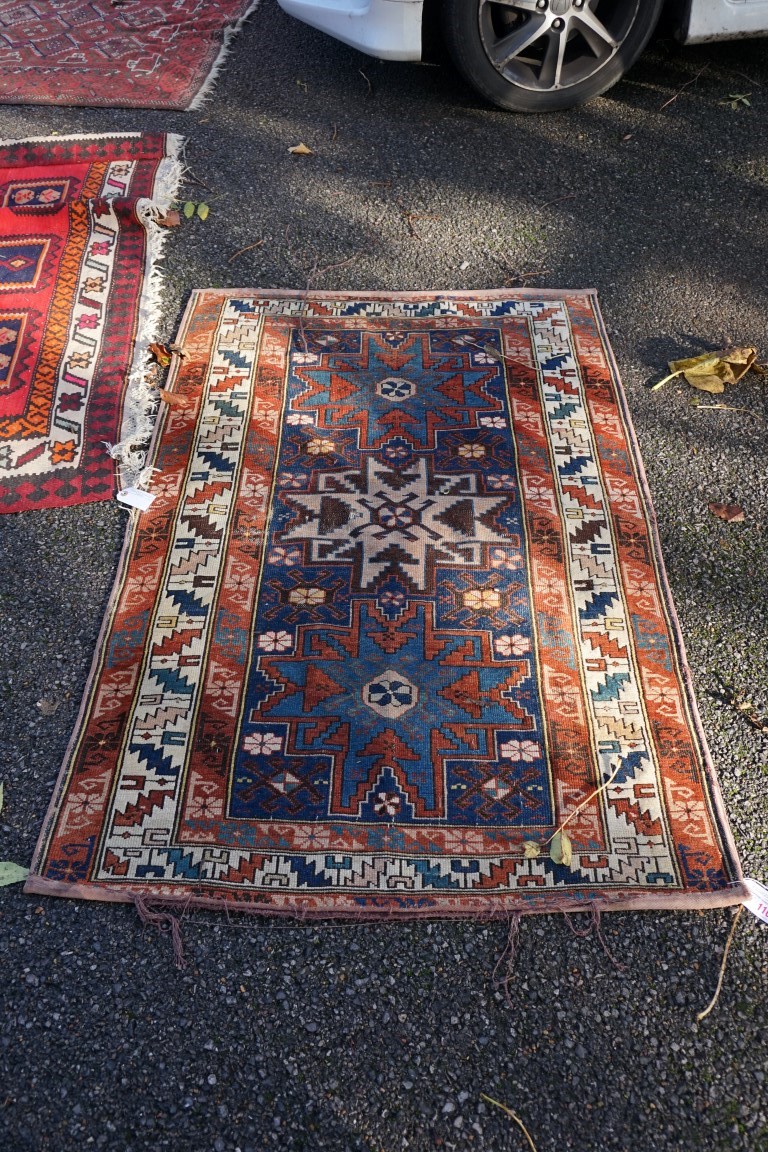 (THH) A small Persian rug, having three central medallions, with geometric borders, 142 x 92cm.