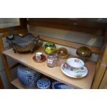 A mixed lot, to include: a Royal Worcester cabinet cup and saucer; and a cast brass tripod bowl.