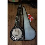 An antique six string banjo, by Barnes & Mullins, the skin measuring 21.5cm diameter, in fitted