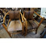 An unusual pair of hide upholstered armchairs.