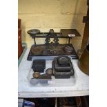 (THH) A set of old postage scales, with various weights.
