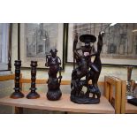 Two Oriental carved wood figures, largest 40cm high; together with a pair of lignum vitae