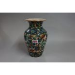 An Islamic pottery vase, 25cm high.