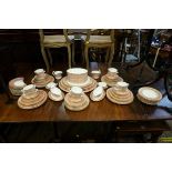 An extensive Royal Worcester pink 'Balmoral' pattern dinner service, comprising: twelve twin handled