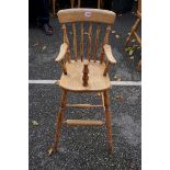 A child's beech and elm high chair. This lot can only be collected on Saturday 19th December (9-