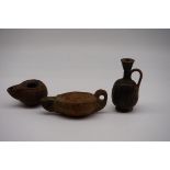 (THH) Antiquities: three Roman pottery items, to include two lamps, the jug 10cm high.