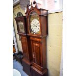 A 19th century mahogany eight day longcase clock, the 13in arched painted dial inscribed 'Thos
