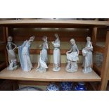 Six Lladro figures, largest 26.5cm high, (chip to index finger of one).