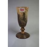 A 19th century turned horn pedestal cup, 18cm high.