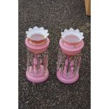 A pair of Victorian pink glass lustres.This lot can only be collected on Saturday 19th December (9-