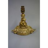 A gilt metal figural lamp, height excluding fitting 15cm.