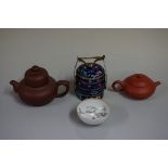 Two Chinese yixing teapots and covers, each with seal mark to base, largest 8.5cm high; together