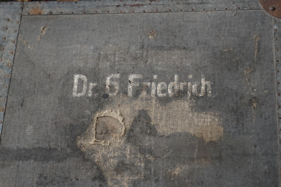 A German metal bound canvas covered travelling trunk, painted 'Dr G Freidrich', by D.R.G.M., 76cm - Image 3 of 6