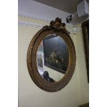 A large 19th century giltwood framed oval wall mirror, 106 x 84.5cm.
